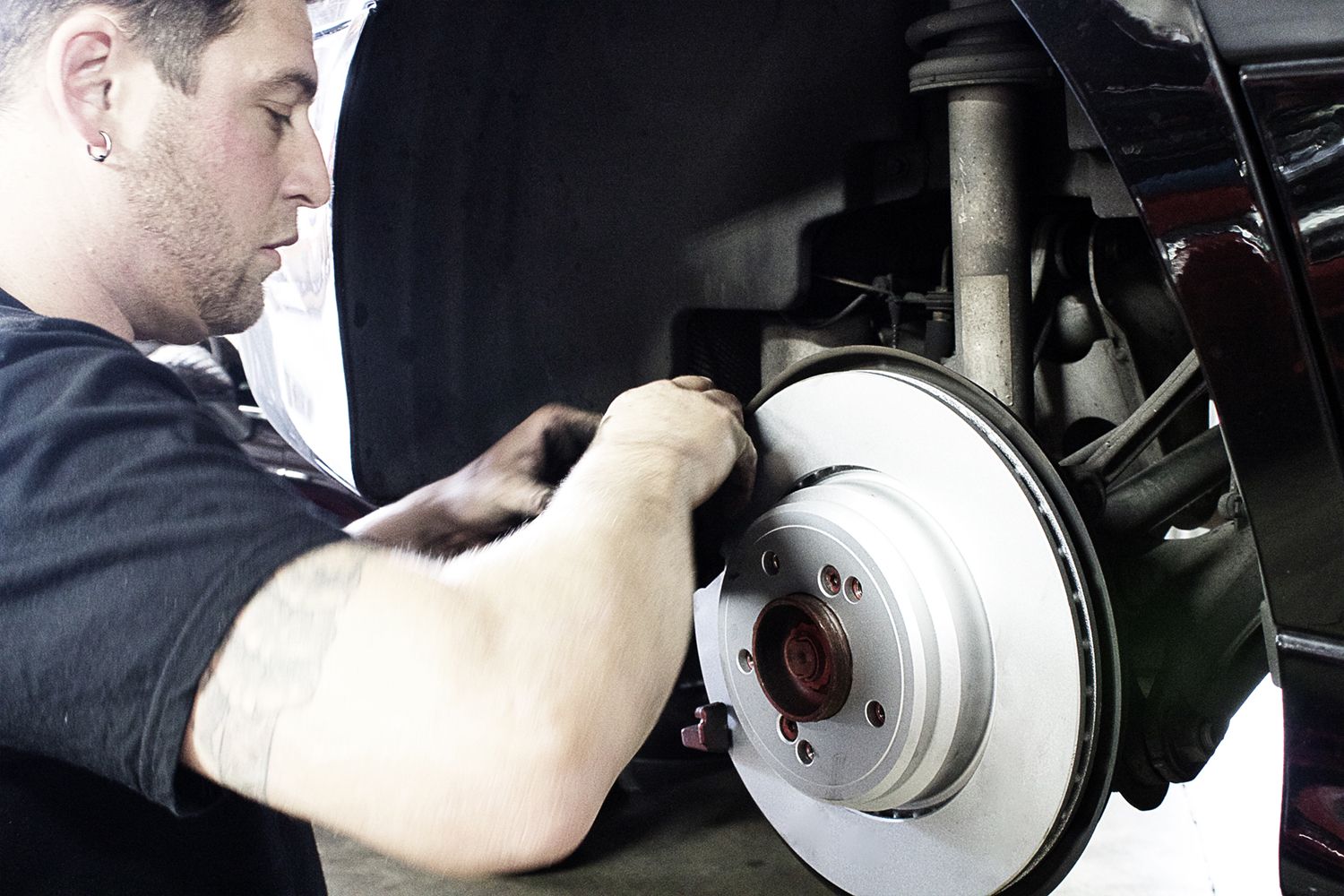 Autobahn owner Zach install brake calipers